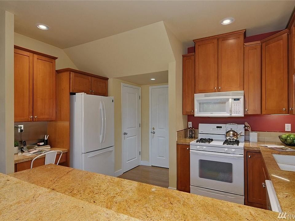 Kitchen with walk-in pantry and garage doors visible