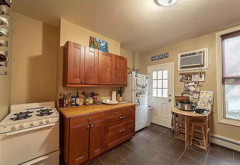 Kitchen looking toward access to private yard. New Oven and fridge since picture has been taken