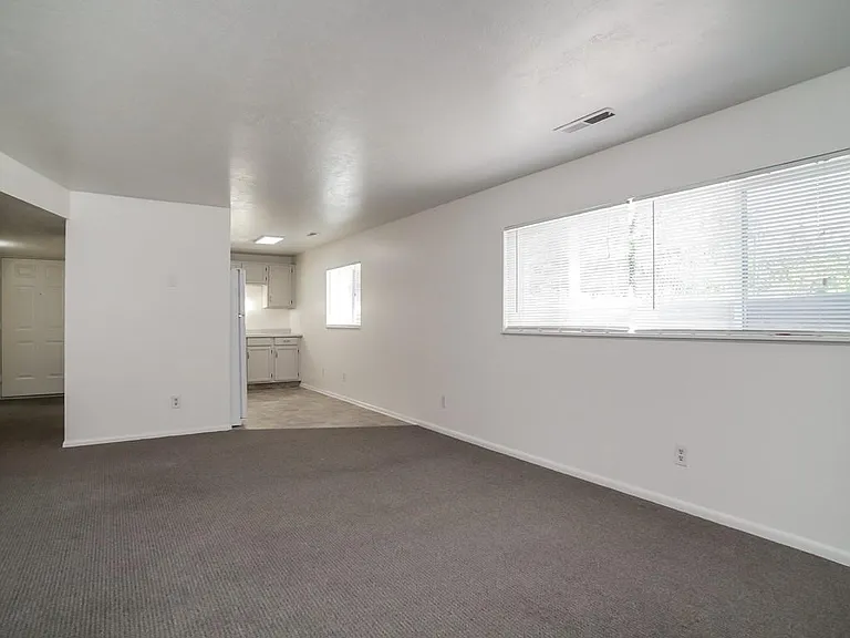 Living Room Opens to Kitchen; Windows in Both Rooms