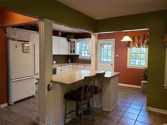 Kitchen with granite island.