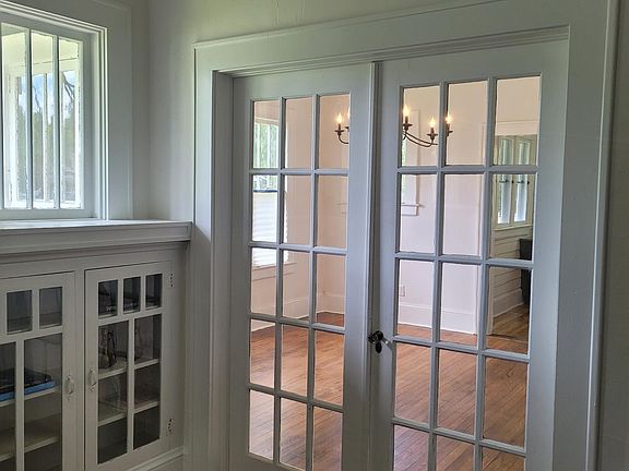 French Doors Open to Dining Room