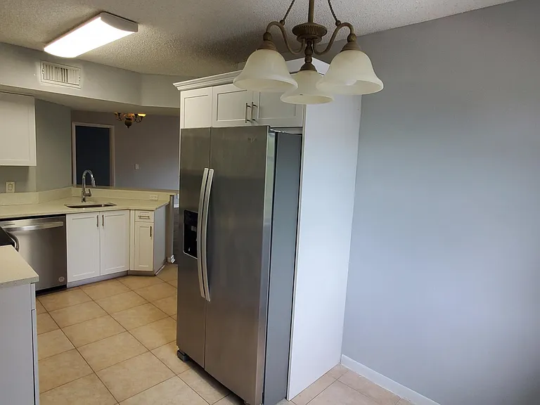 9033 Wiles Rd #308 — Photo 10