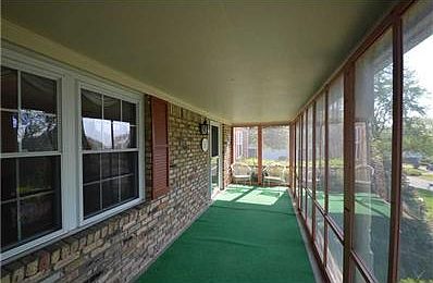Porch. Concrete below green rug, endless possibilities in this space!