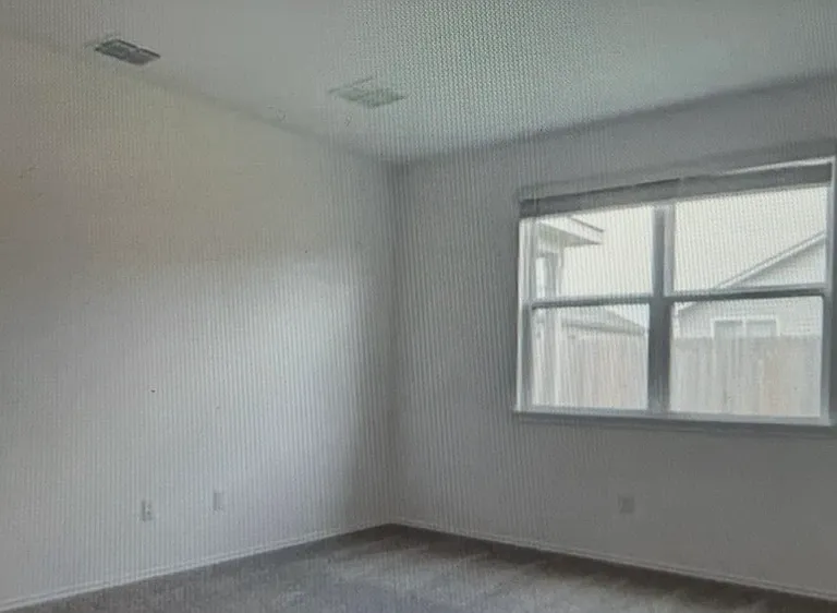 primary bedroom looking to backyard