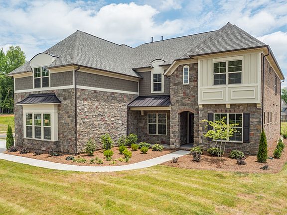 Stonegate Exterior 7 features stone, shakes and covered front door