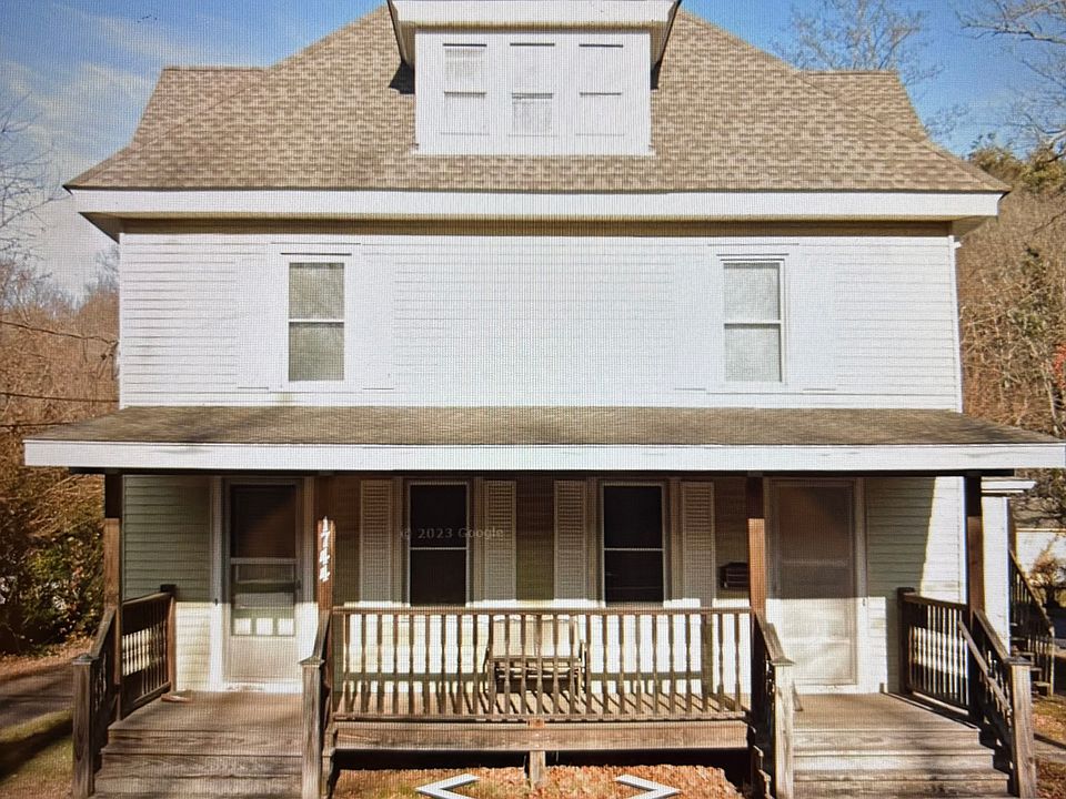Front porch. Door on right is to the one bedroom apartment.