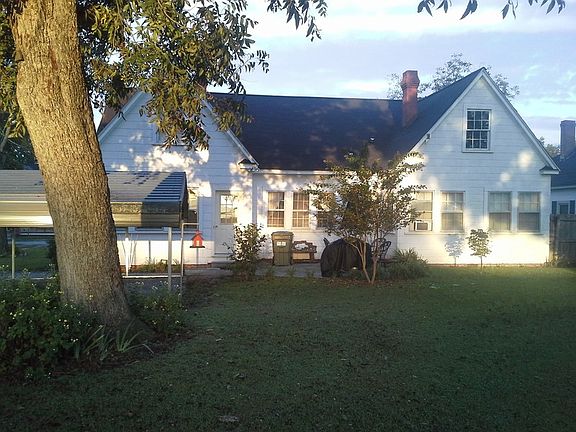 Back side of our home. : Pic shows back of our house w/ carport. House has 40 windows, 6 in the atti