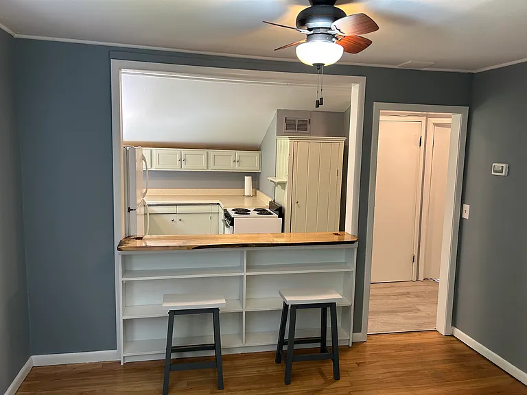 Living room opens into Kitchen