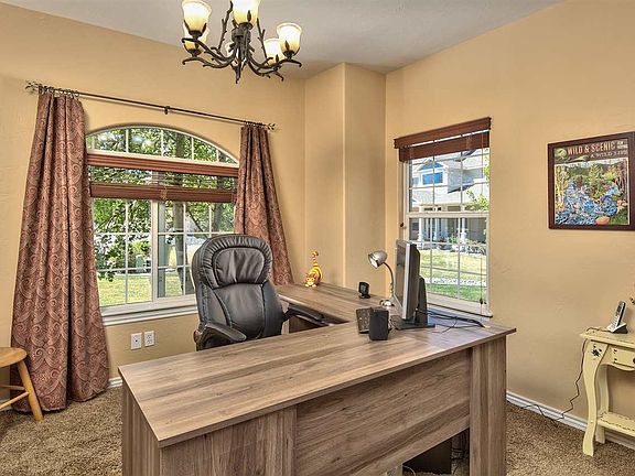 This spacious home offers a separate office in addition to 4 bedrooms, a living 