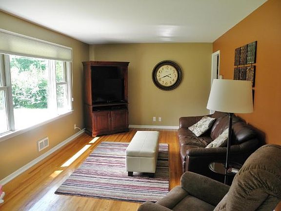 Comfy living room with refinished hardwood floors