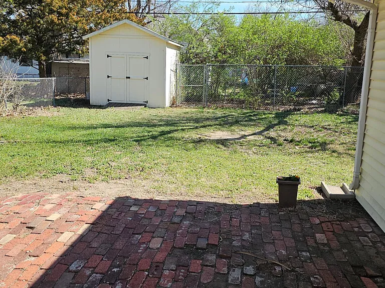 Large, fenced backyard.