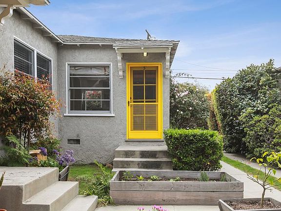 Front View-Front door and raised vegetable/flower garden planter