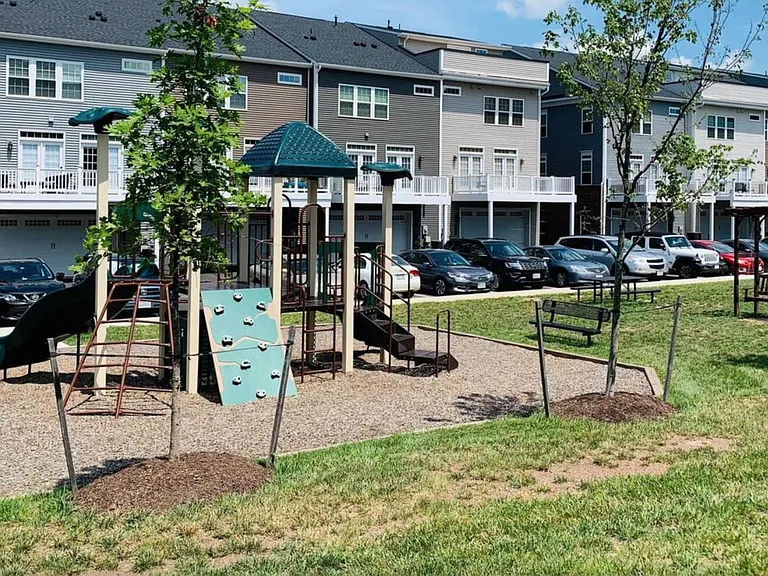 Lot of parking spots with tot lot