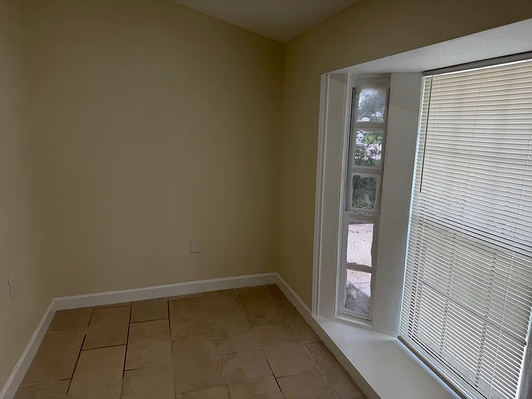 Office/Study with door and front window. Can also be a small (5th) bedroom.