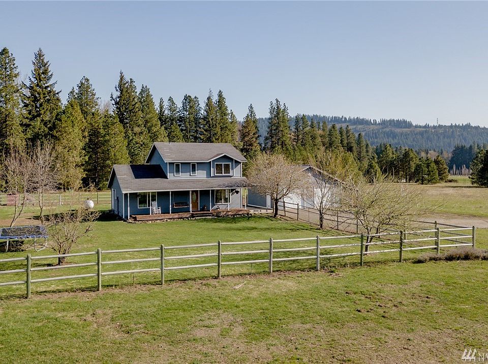Immaculate 4 bedroom home on 2.74 acres with quick access to I-90.