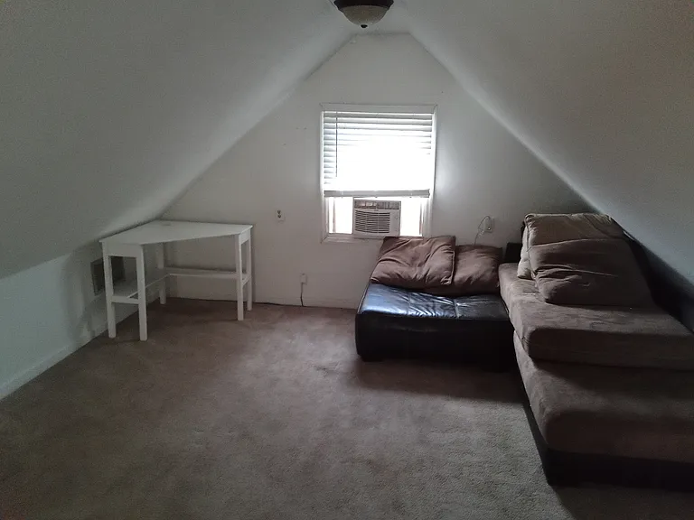 large great room upstairs with endless possibilities. couch and table pictured stay with house
