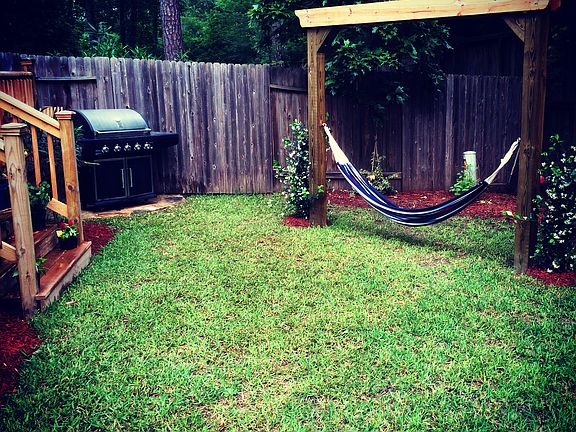 Large deck and lush greenery