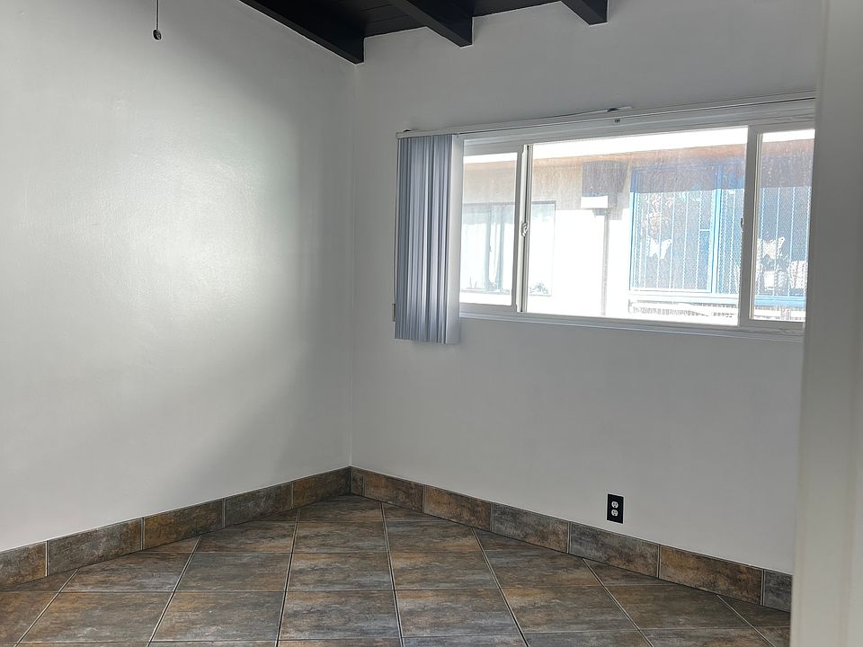 Bedroom with beamed ceilings