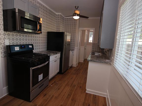 Kitchen with all new stainless steel appliances. Stove, Refridgerator, & Microwave.
