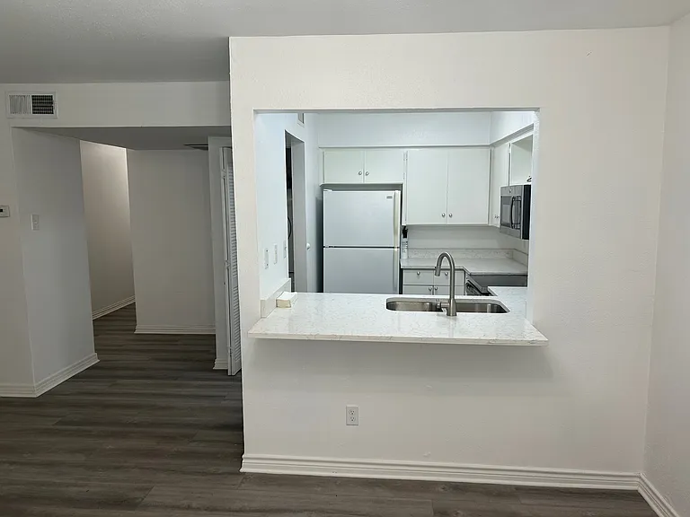 Fully equipped kitchen open to the living room. Refrigerator is included in the rent.
