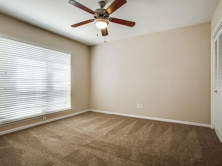 Bedrooms with Large Windows and Ceiling Fans
