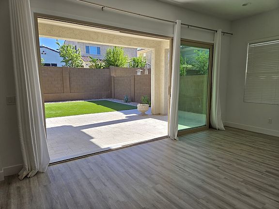 Oversized sliding door opening out to patio