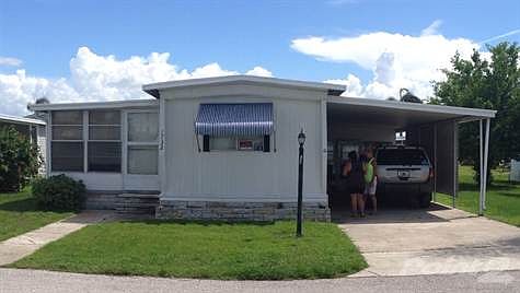 STREET VIEW W CARPORT & FLORIDA RM