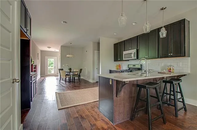 Fully functional kitchen with gas range and stainless appliances as well as a coast closet just to the left of the stainless fridge (not pictured)