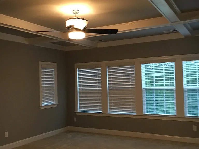 Master bedroom with coffer ceiling