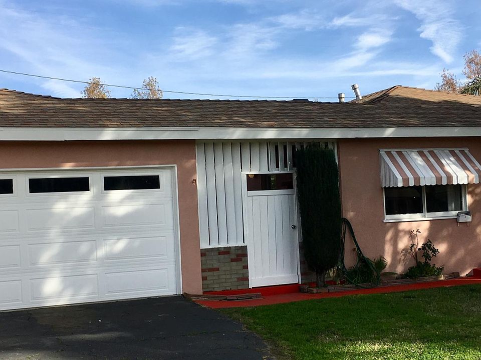 Front of home; beautiful covered breezeway between garage & home; all new paint on home both inside and outside