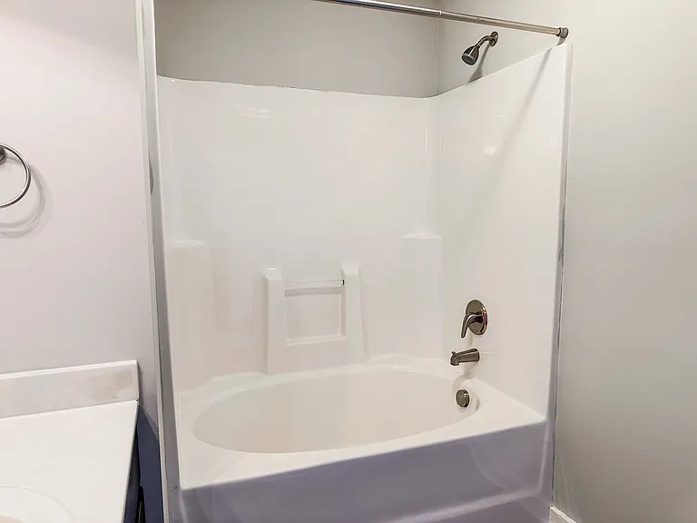 The primary bathroom features a garden tub.