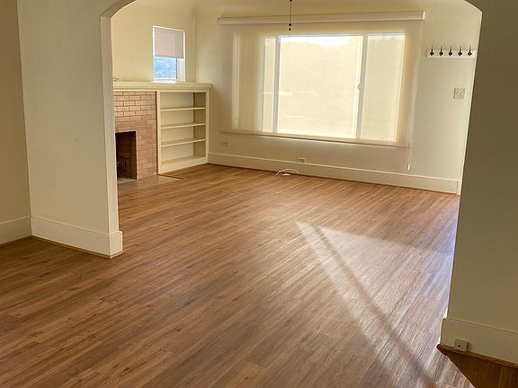 large dinning room looking into the living room.