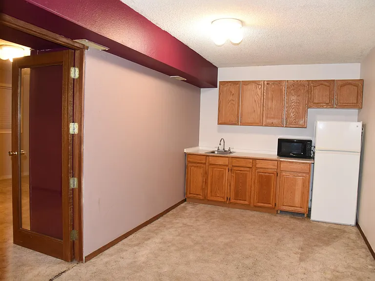 Downstairs, next to studio to the left.