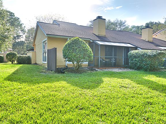 Lanai with semi-private back yard