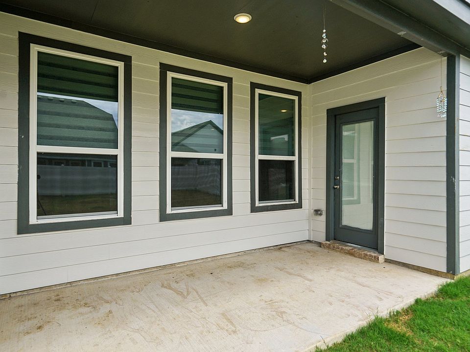 Back covered patio. Sit in the shade while the kids (2 legged or 4 legged) play in the yard...