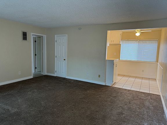 Nice large living room with new sliding glass door. Also has nice dining area.