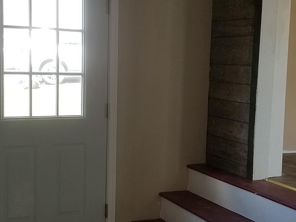 Back door and steps up to Family Room