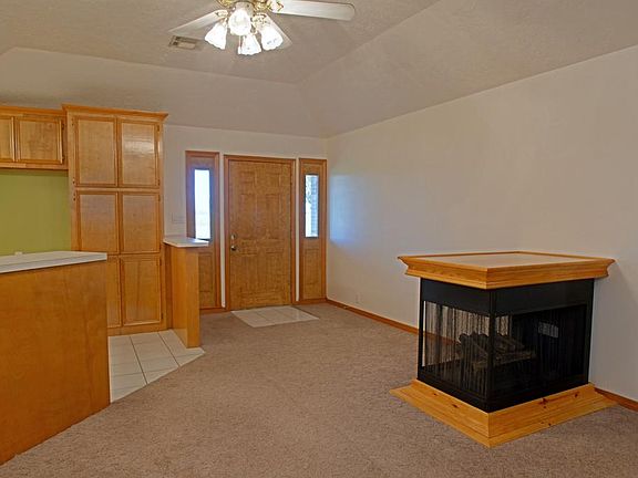 View of the entryway of the home..the ventless fireplace is portable!