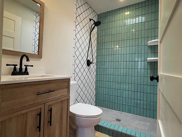Newly renovated bathroom with hand painted mexican tile.