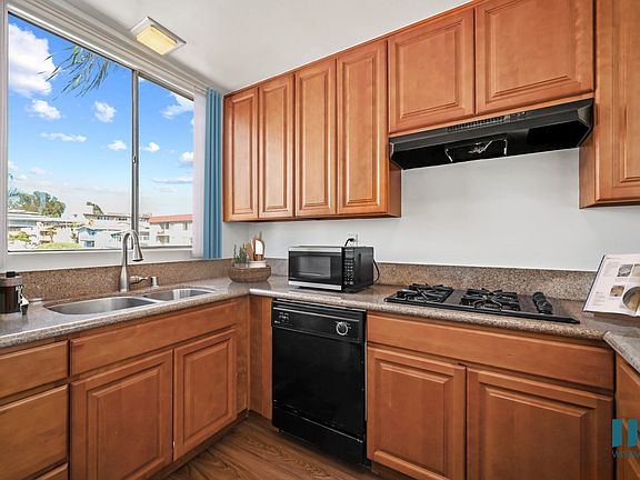 Kitchen with Gas Range, Dishwasher, and Microwave