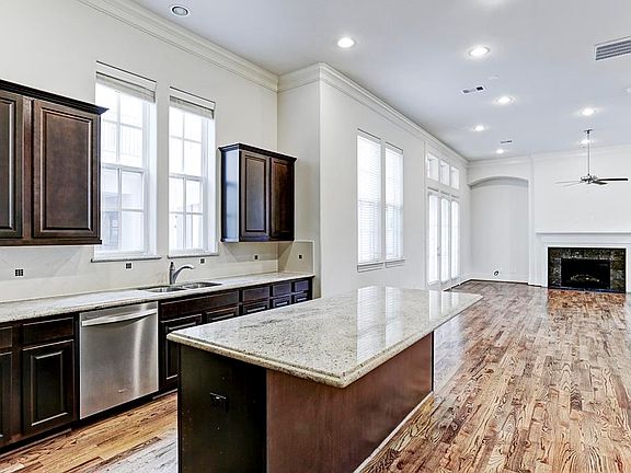 Open kitchen with granite counter tops.