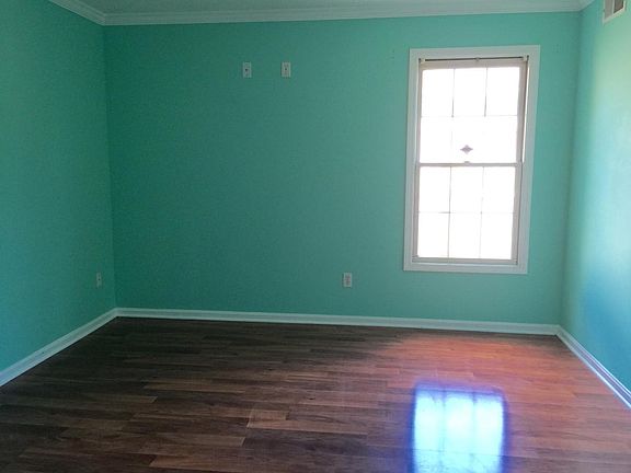Master bedroom downstairs. This is an old picture since tenant is still living there. The paint has already been changed to gray.