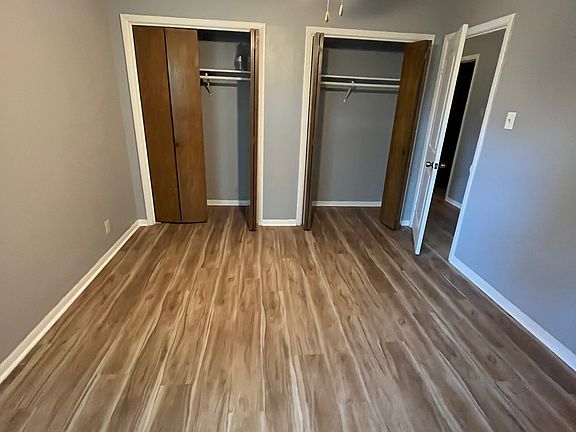 bedroom with two closets