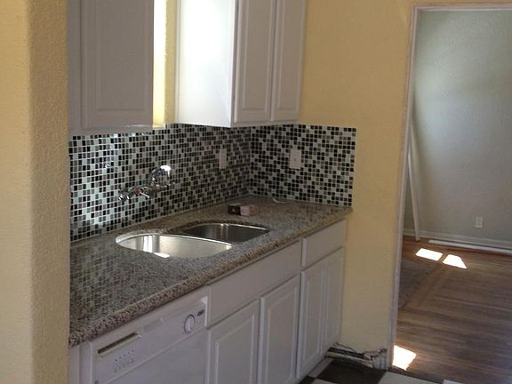 Kitchen w/ granite tops, dishwasher, disposal