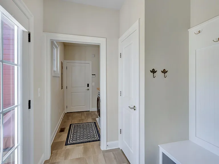 Mudroom off the kitchen, connecting to the garage.