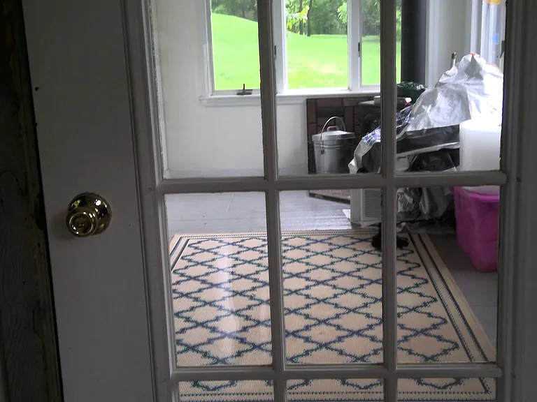 View to entry/enclosed porch, Vermont Castings wood stove