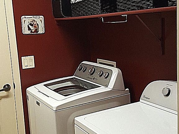 Laundry room with shelving