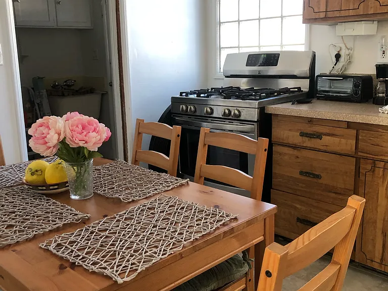 Dinette set in the kitchen for privacy. Included are all appliances: Stove, Fridge, W/D.
