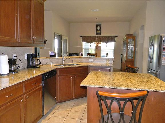 Kitchen with Tiled backsplashes.
