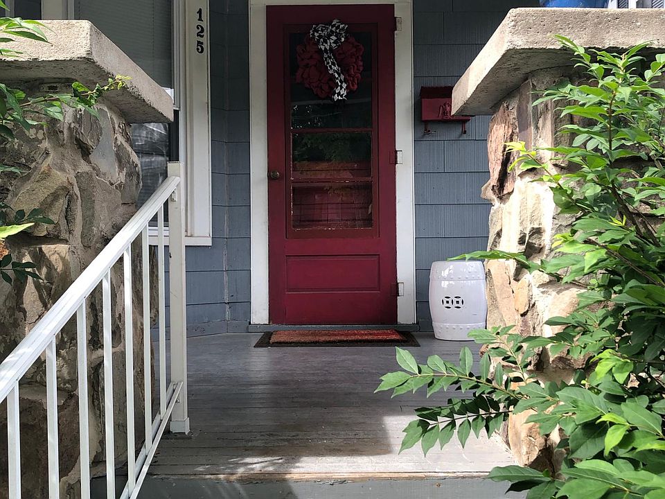 Spacious front porch with stone columns